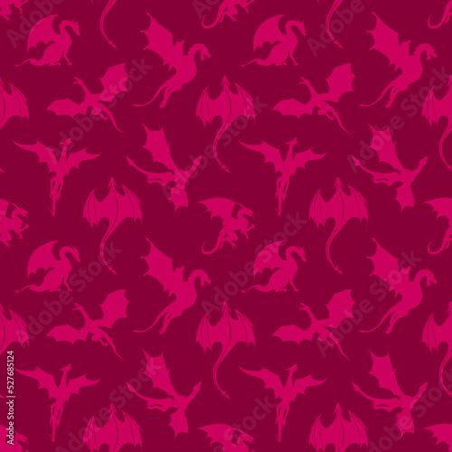 Seamless pattern made up of pink dragons and wyverns. Endless repeating monochrome texture for printing on package, gift paper, wrappers, textile, envelopes, cards or cloth. photo