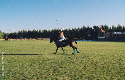 Female jockey riding horse in paddock © BullRun
