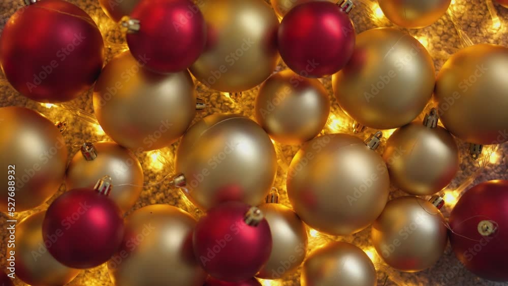Christmas decorations close-up. Christmas balls background. Red and gold Christmas tree balls. New Year's decor for festive winter atmosphere of home comfort. Season winter rest, holiday. Abstraction. Christmas decorations close-up. Christmas balls background. Red and gold Christmas tree balls. New Year's decor for festive winter atmosphere of home comfort. Season winter rest, holiday. Abstraction.
