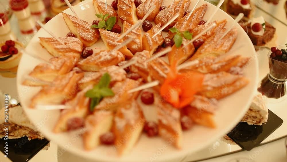 dessert buffet pastries cakes biscuits catering buffet at holiday party, wedding in restaurant. small cakes decorated with fresh berries stand transparent tray. presentation food decoration serving