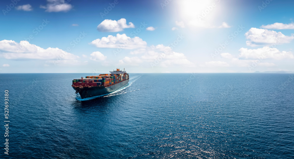 Panoramic front view of a cargo ship carrying containers for import and export, business logistic and transportation in open sea with copy space - obrazy, fototapety, plakaty 