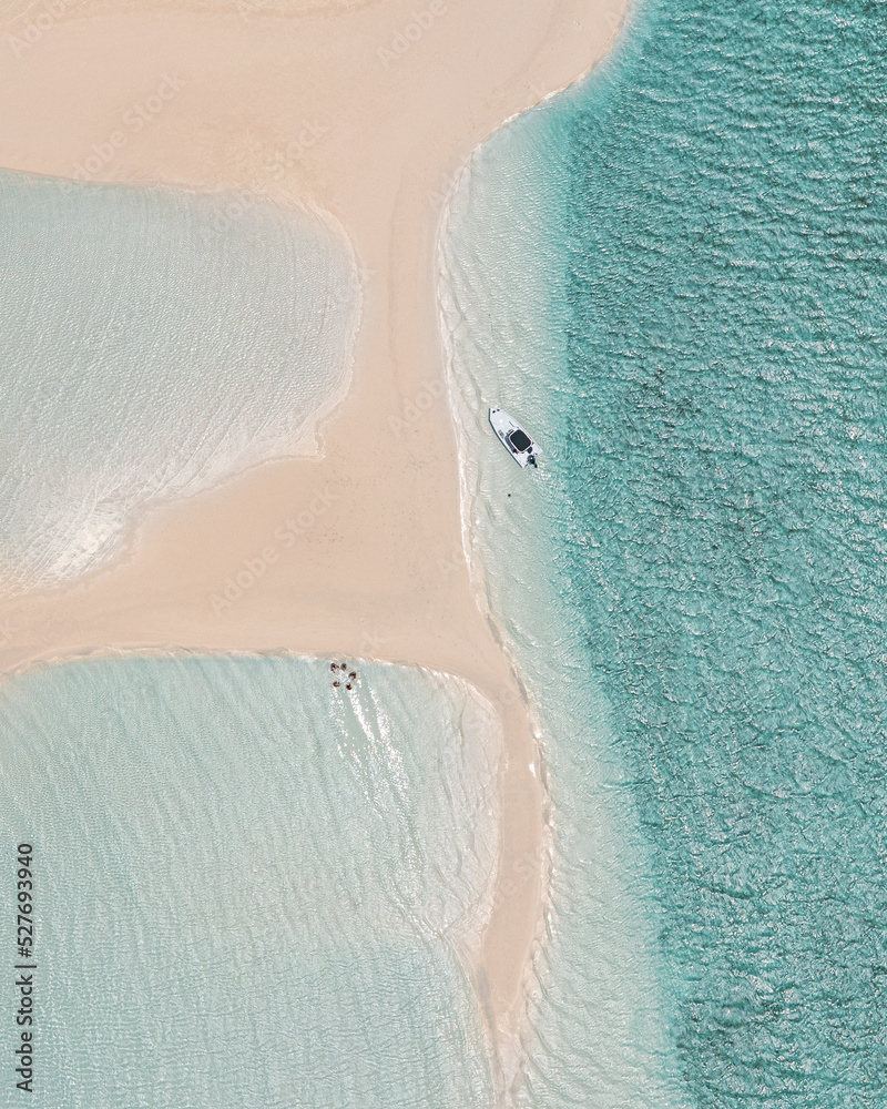 Aerial view of a boat on a sandbar in the Bahamas