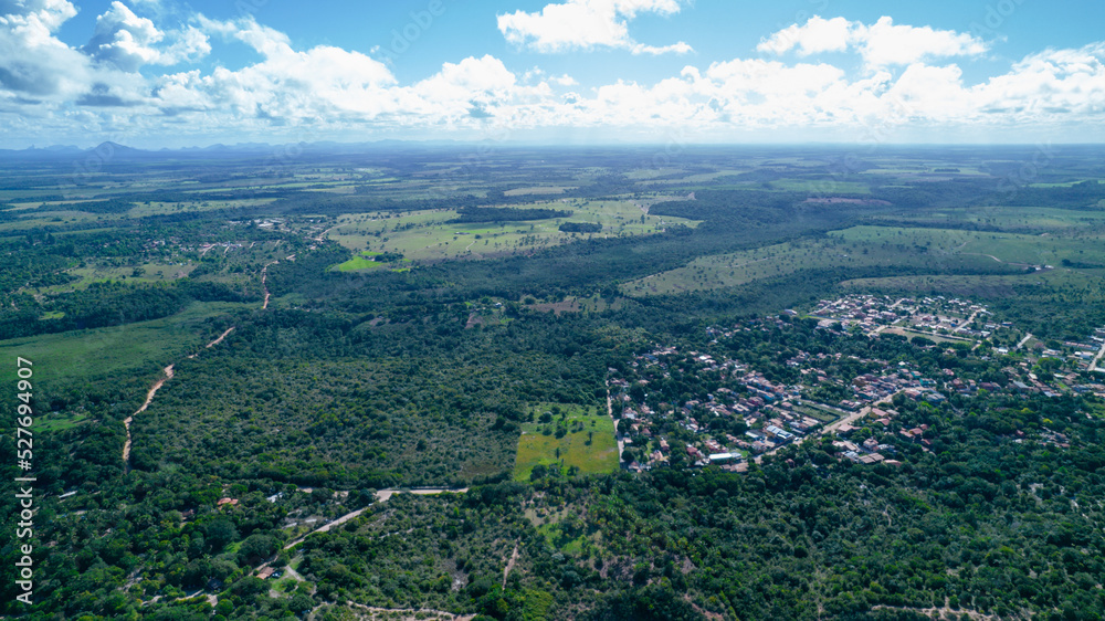 Fototapeta premium Aerial view of Caraiva beach, Porto Seguro, Bahia, Brazil. Colorful beach tents, sea and river