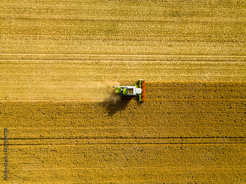 Aerial drone view of a harvester in Germany, close to Frankfurt