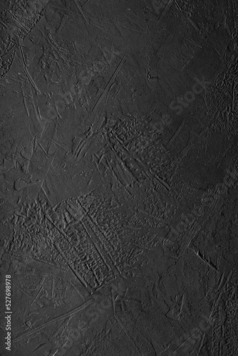 Fondo oscuro de concreto negro con textura irregular de cemento