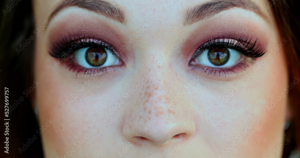 Fototapeta premium Pretty girl closeup macro eyes opening. Young woman face