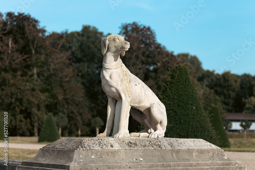 White statue of a dog.
