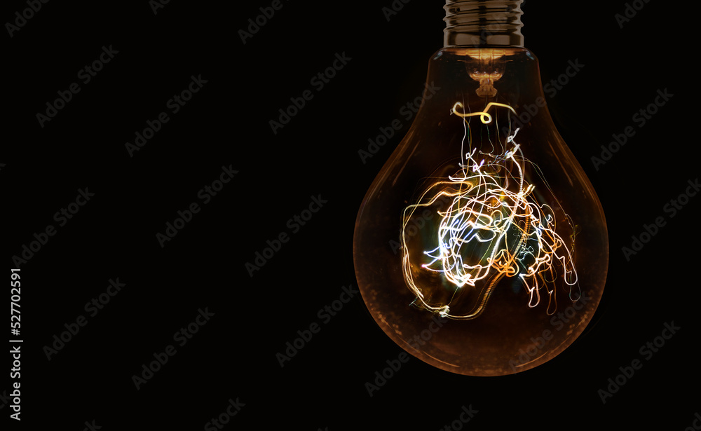 Electric light bulb on the dark background Electric light bulb on the dark background