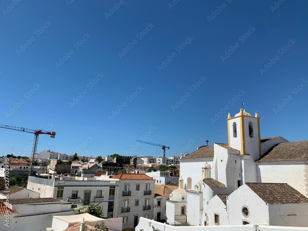 White storks on a local church in Faro, Portugal