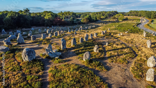 Aerial view of the Carnac stone alignments of Kermario in Morbihan, France - Prehistoric menhirs and megaliths in rows in Brittany