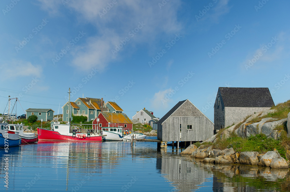 Scenic view of the fishing village of Peggy's Cove, Nova Scotia with some boats docked.