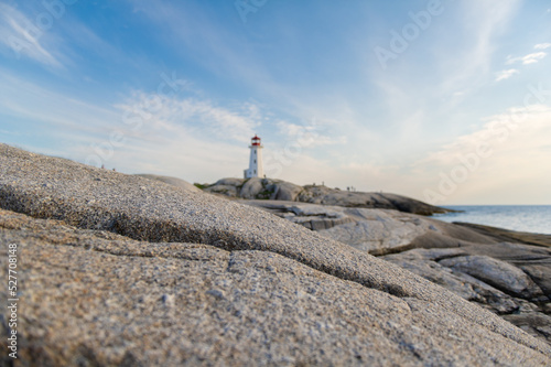 Out of focus lighthouse in Peggy's Cove from the near by rocks © AC Photography