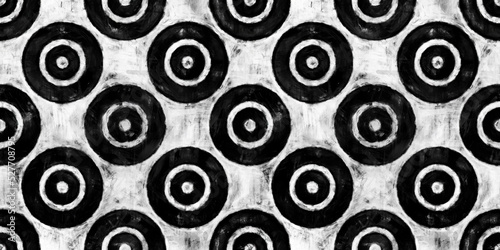 Seamless painted concentric circles or bullseye target motif black and white artistic acrylic paint texture background. Tileable creative grunge monochrome hand drawn wallpaper pattern design.