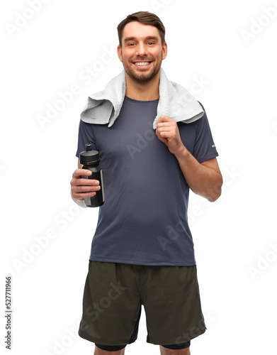 fitness  sport and healthy lifestyle concept - smiling man in sports clothes with bottle and towel over white background