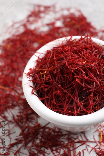 Aromatic dried saffron on table, closeup view