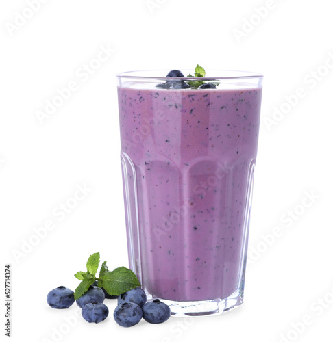 Glass of blueberry smoothie with fresh berries and mint on white background