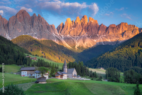 St. Magdalena with famous church in Val di Funes at sunset, Dolomites , Italy