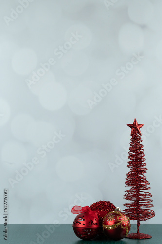 Red Christmas decor portrait with negative space on green table with white background