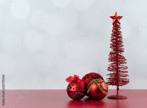 Red Christmas decor landscape with negative space on white background and red table 