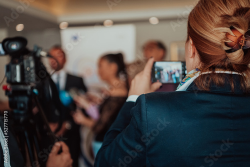 Valokuva professional video production camera recording live event on stage