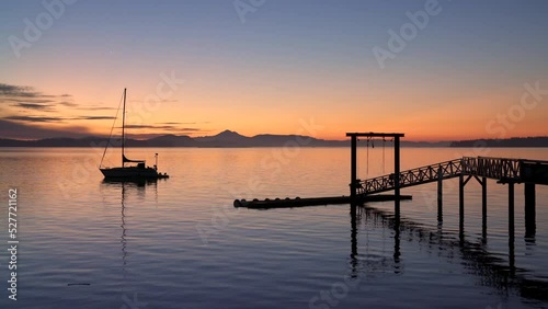 Sidney BC Sailboat and Pier Twilight Dawn 4K UHD. Summer dawn twilight behind a pier and sailboat in Sidney British Columbia, Canada. 4K, UHD.
 photo