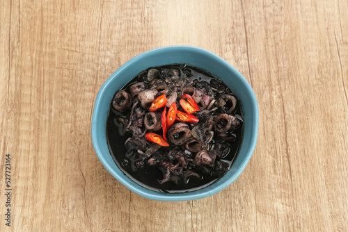 Squid Black Soup (Tumis Cumi Hitam) or stir-fried squid in black ink, Indonesian traditional food
