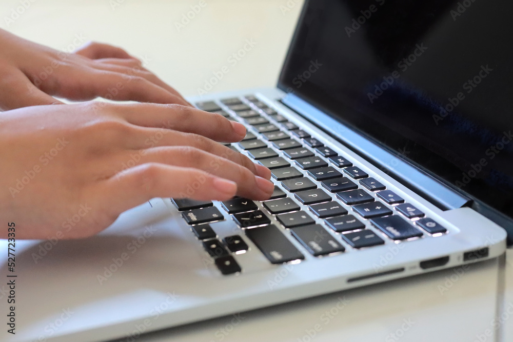 Close up of Hand typing on laptop keyboard. Technology and communication concept Close up of Hand typing on laptop keyboard. Technology and communication concept