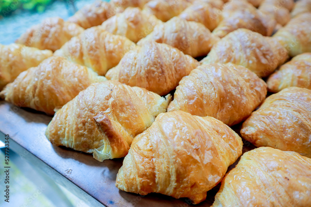 Fresh croissant on wooden table for morning breakfast Fresh croissant on wooden table for morning breakfast