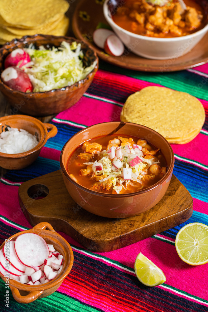 clay dish with red pozole, Mexican national holidays with Mexican food, accompanied by toast, september 16 clay dish with red pozole, Mexican national holidays with Mexican food, accompanied by toast, september 16