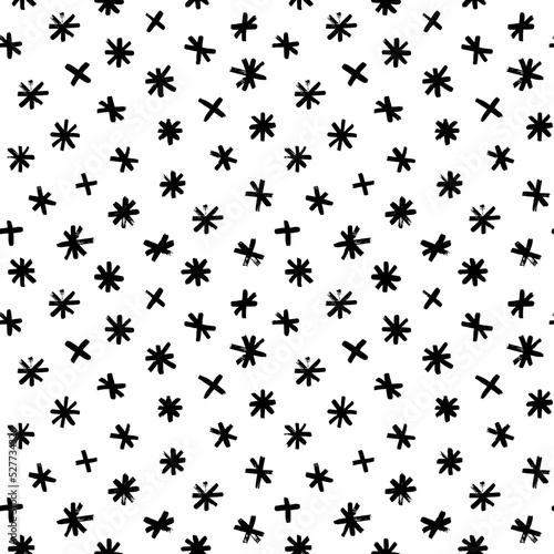 Seamless pattern with hand drawn snowflakes. Christmas and holiday ornament with small snowflakes or stars. Stylised symbol of winter. Hand drawn black vector abstract pattern. New Year decoration.