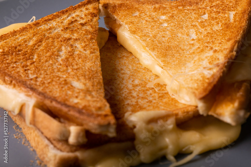 High angle close-up view of fresh cheese toast sandwich stack