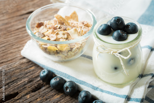 yogurt with fresh blueberry on a wooden background. healthy cereal morning breakfast,oat