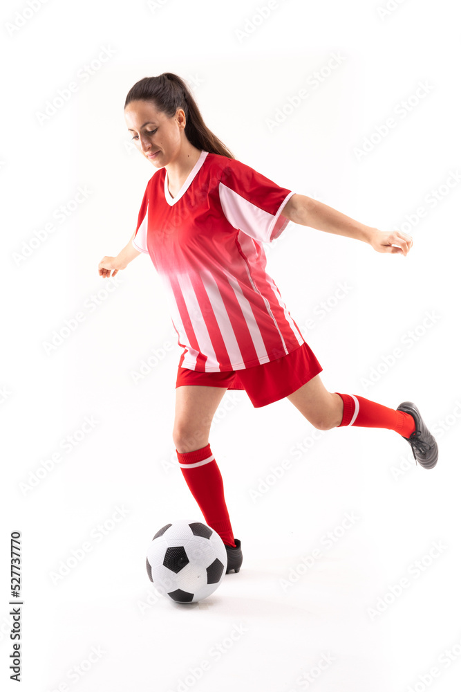 Caucasian young female player with arms outstretched playing soccer against white background