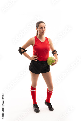 Full length of caucasian young female player with handball standing against white background