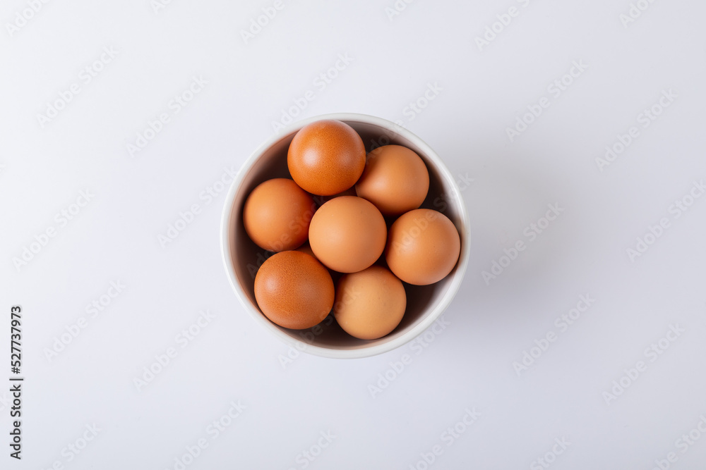 Directly above shot of brown eggs in bowl on table Directly above shot of brown eggs in bowl on table