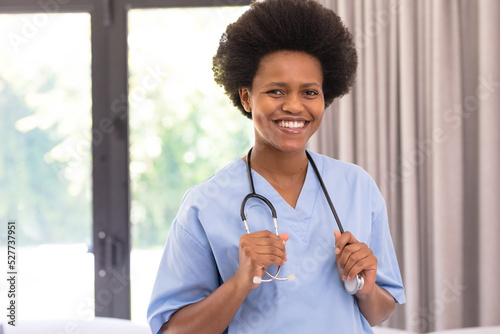 Portrait of smiling african american mid adult female doctor with stethoscope in hospital