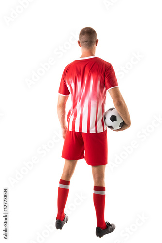Full length rear view of caucasian male athlete holding soccer ball over white background