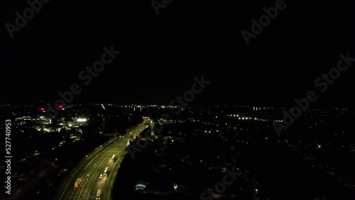Night Aerial View of British Motorways with illuminated Roads and Traffic