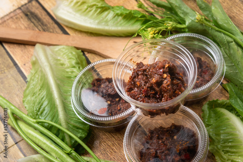 Asian street food chili paste, on the wooden floor, chili paste