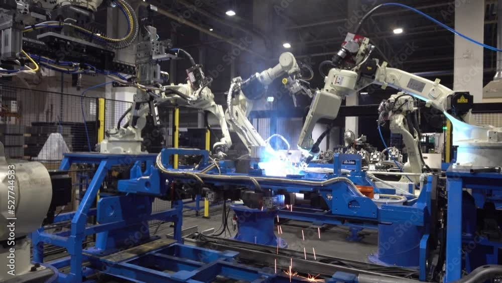 Automatic welding robotic arm, welding car parts with automatic robot, using robots to weld car parts.