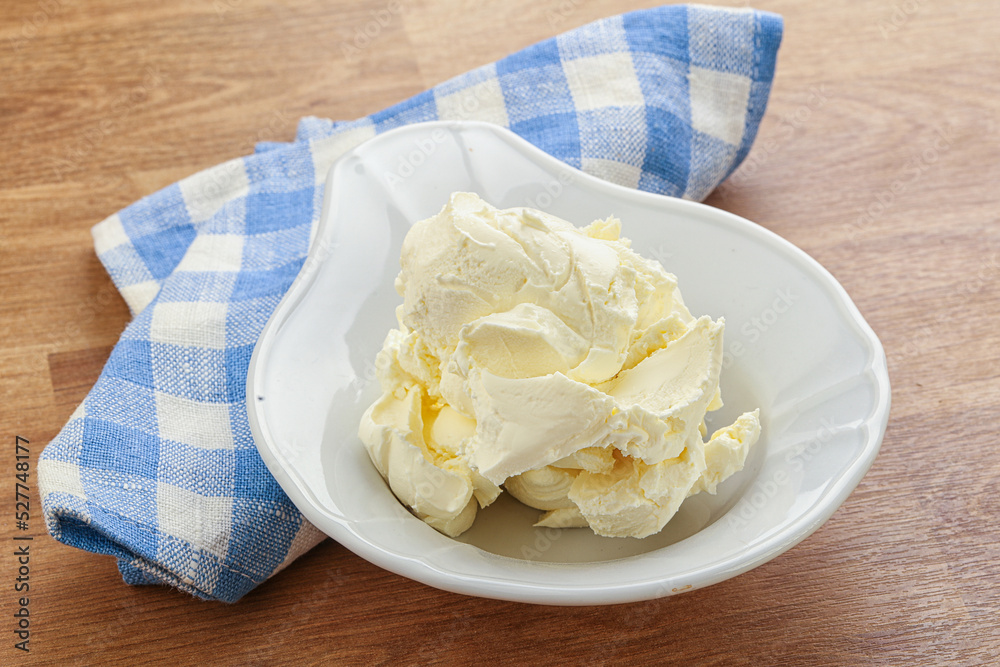 Italian soft mascarpone cheese in the bowl Italian soft mascarpone cheese in the bowl