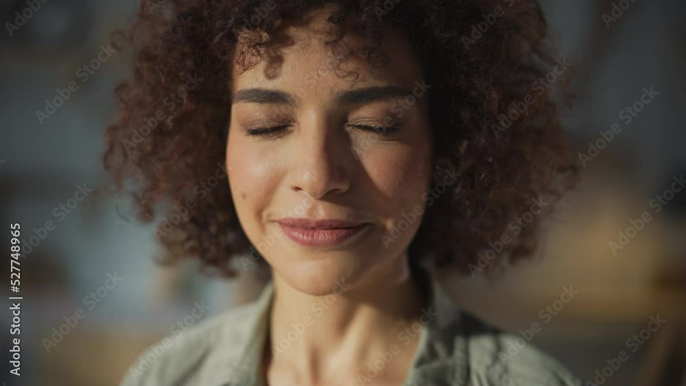Close Up Portrait of a Dark-Skinned Multiethnic Brunette with Curly Hair and Brown Eyes. Happy Creative Young Woman Looking at Camera and Charmingly Smiling. Close Up Portrait of a Dark-Skinned Multiethnic Brunette with Curly Hair and Brown Eyes. Happy Creative Young Woman Looking at Camera and Charmingly Smiling.