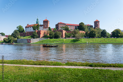 View of the beautiful royal castle at Wawel in Krakow. Boulevards over the Wisla River