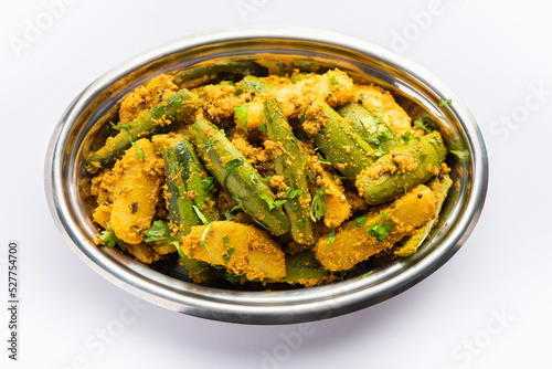 Aloo Potol or Dalna Recipe is a traditional sabzi from bengal made with potato & pointed gourd photo