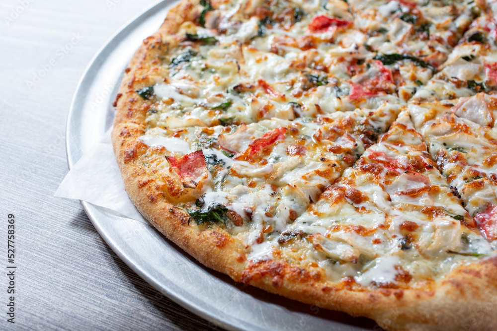 A view of a crab and spinach pizza.