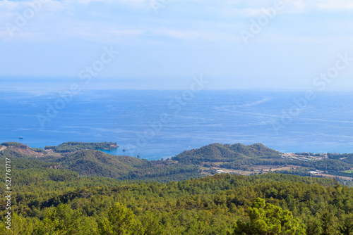View of the Taurus mountains and the Mediterranean sea from a top of Tahtali mountain near Kemer, Antalya Province in Turkey photo