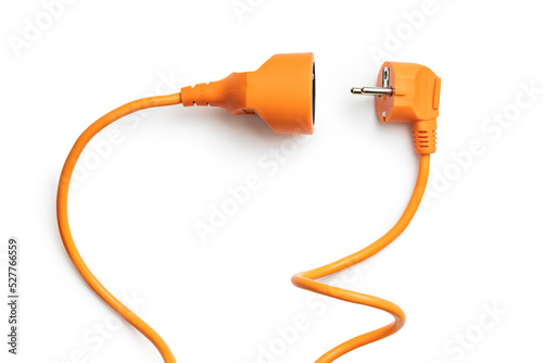 Disconnected orange electric plug and socket isolated on white background. photo