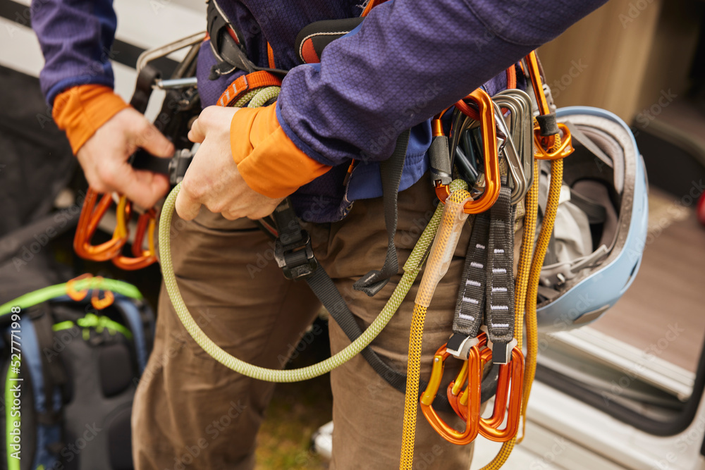 Rock climber putting gear on Rock climber putting gear on