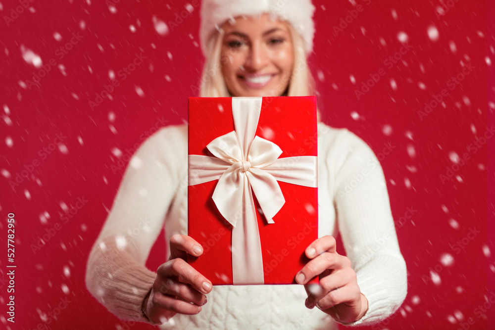 Beautiful woman holding a present 
