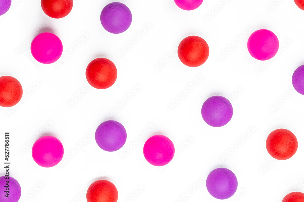 Abstract colored balls background. Red, pink taw toy scattered on isolated white background. Base for design nice backdrop, wallpaper, poster Abstract colored balls background. Red, pink taw toy scattered on isolated white background. Base for design nice backdrop, wallpaper, poster